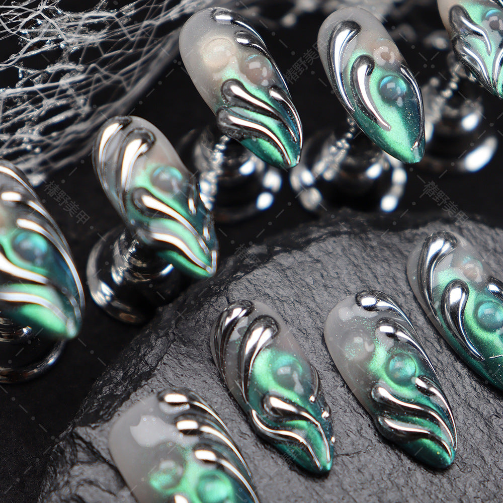 Futuristic nail design in silver, perfect for a statement-making look.