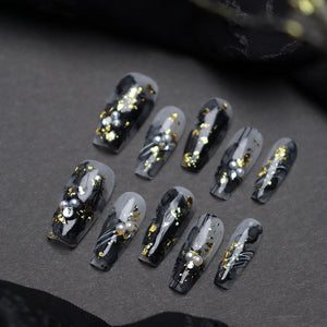 Reusable black gold coffin nails styled for elegance.