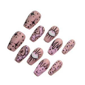 Medium-length press-on nails with pink graffiti patterns