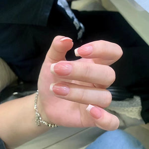 Medium-length French milky nails showcasing timeless style.