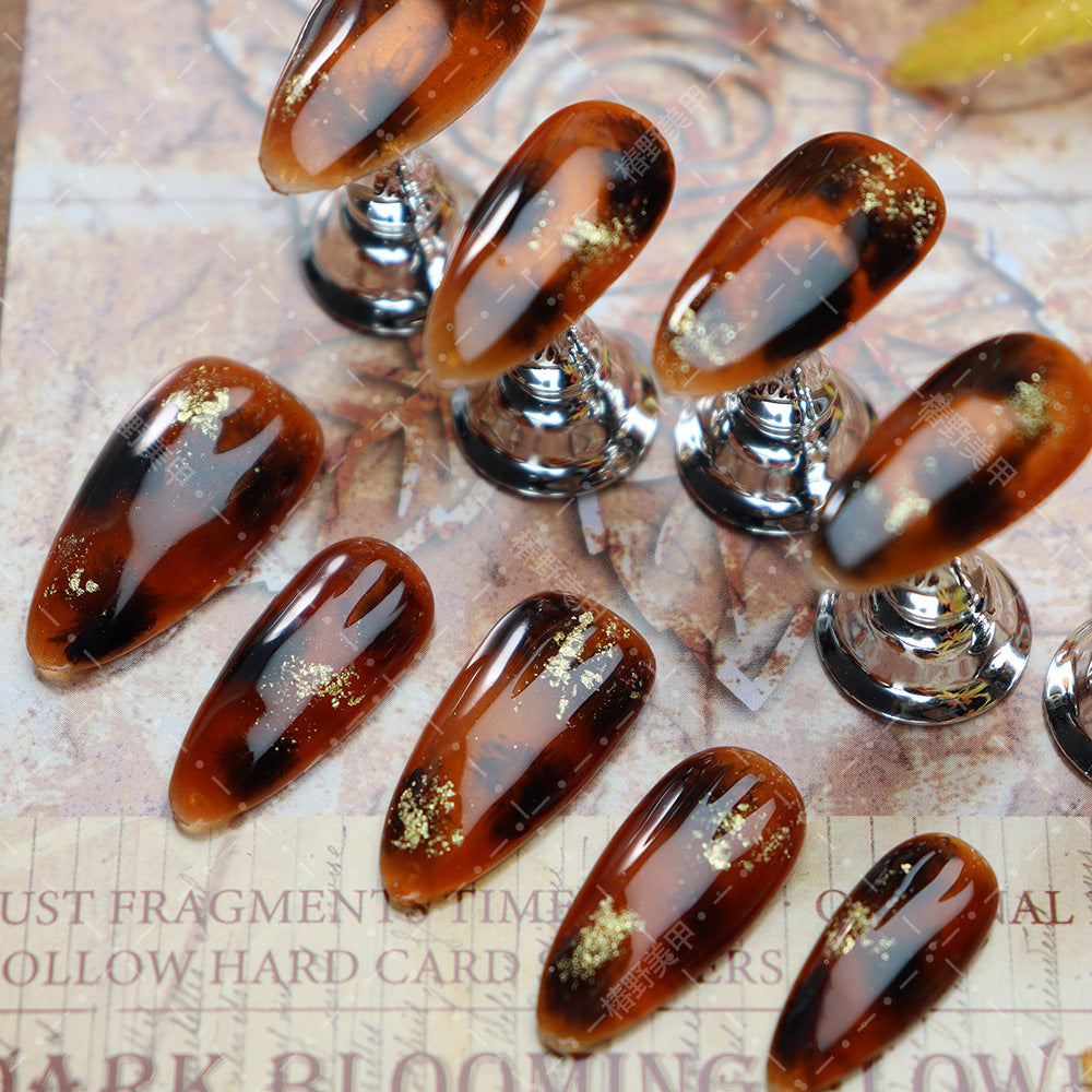 Le Romey amber nail stickers showcasing their reusable design.