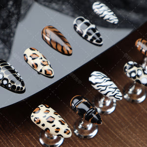 Side view of animal print press-on nails showcasing their detailed design.