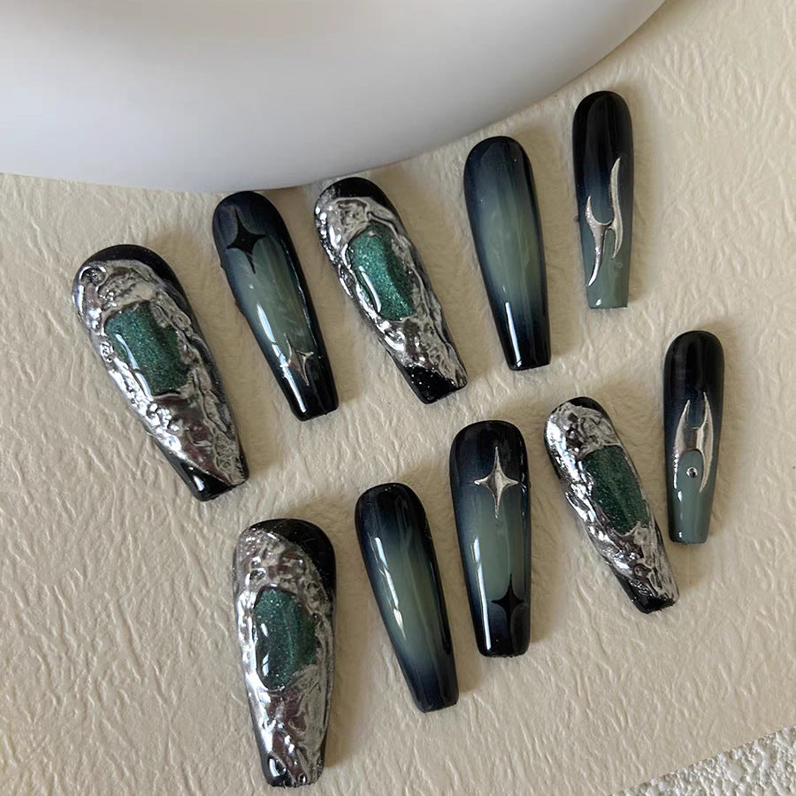 Emerald coffin nails with 3D metallic accents and ombre shading.