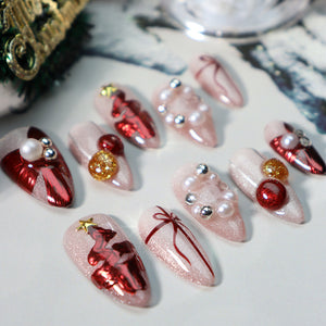 Close-up of festive pearl white press-on nails with glossy accents.