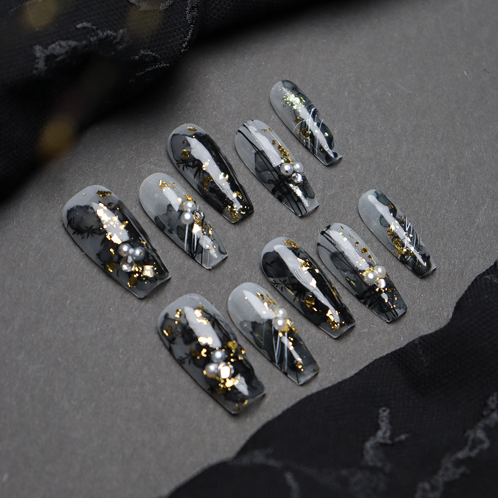 Custom bamboo-pattern coffin nails with golden accents.