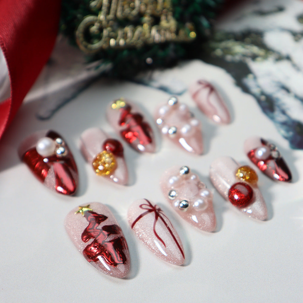 Reusable almond press-on nails with chic pearl and festive accents.