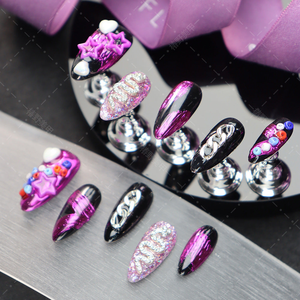 Premium almond press-on nails showcasing colorful beads and snake motifs