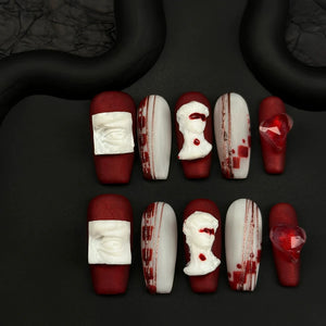 Elegant gothic nails with David-inspired 3D art and red accents.