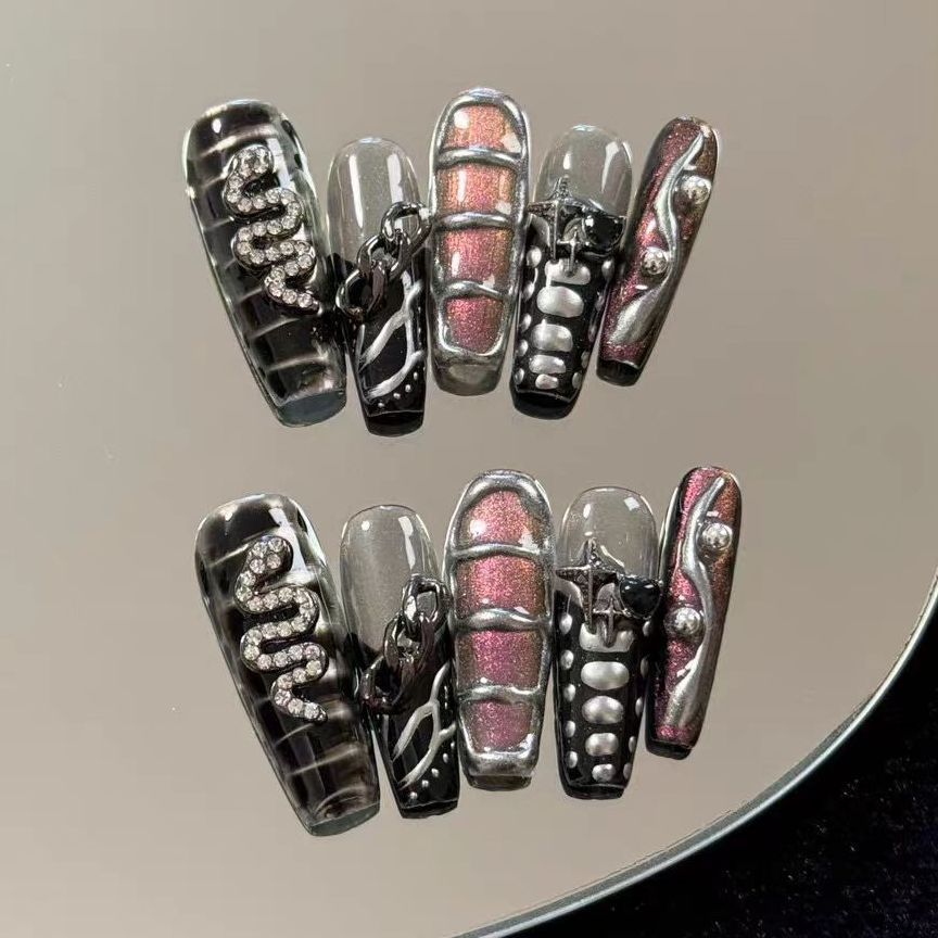 Cyberpunk 3D coffin nails with metallic designs and chains.