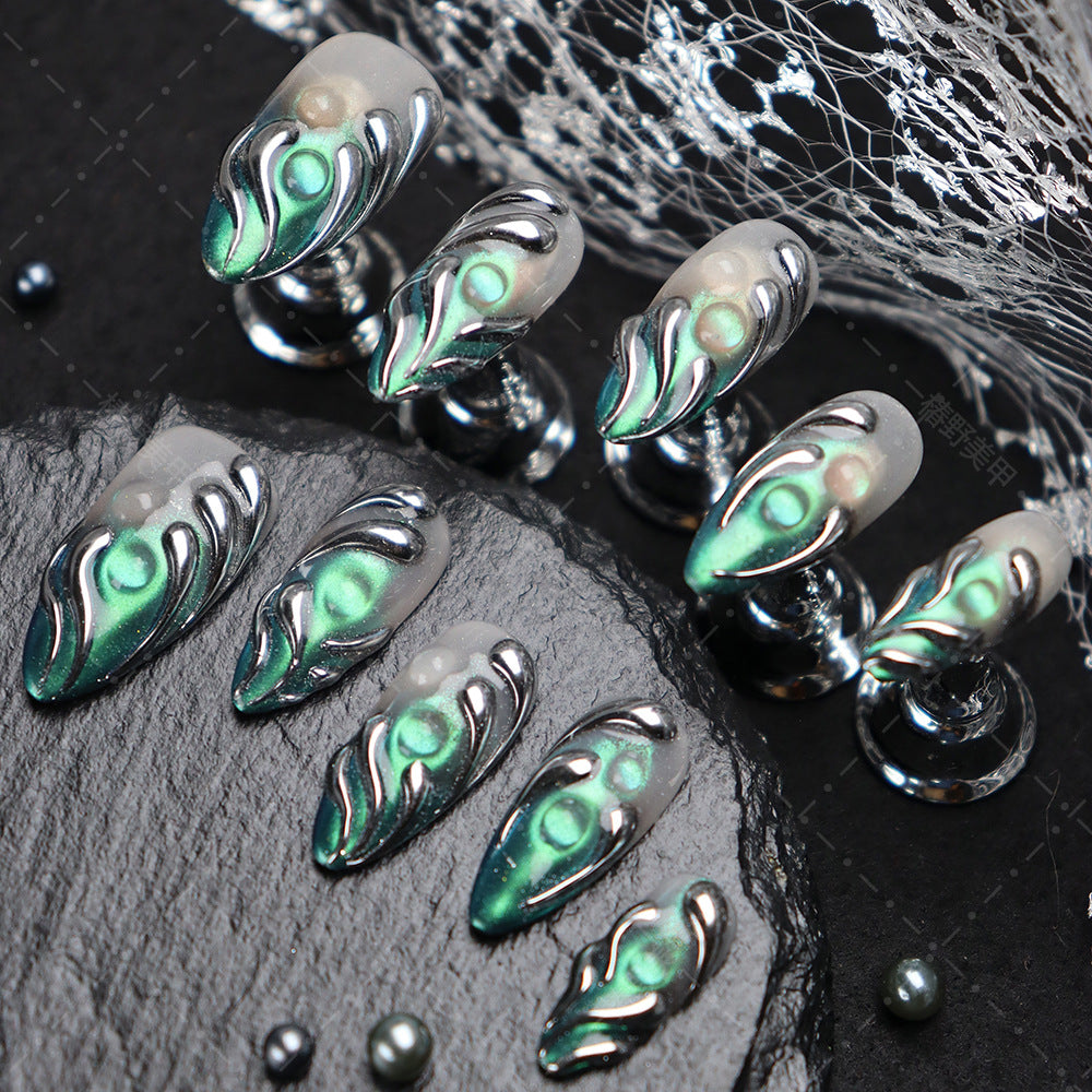 Close-up of metallic nail art showcasing bold details and modern style.