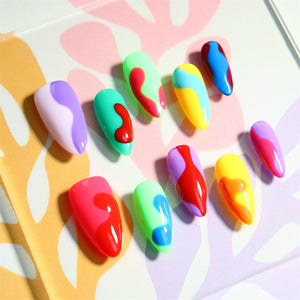 Vibrant almond-shaped press-on nails with playful designs.