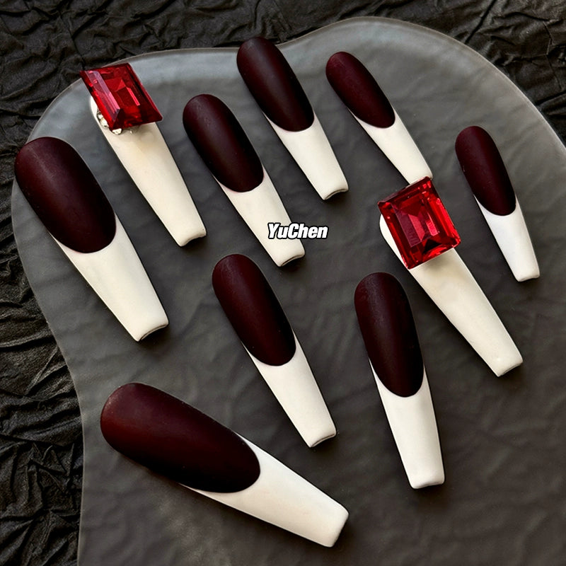 Elegant coffin-shaped nails featuring blood red and white design.